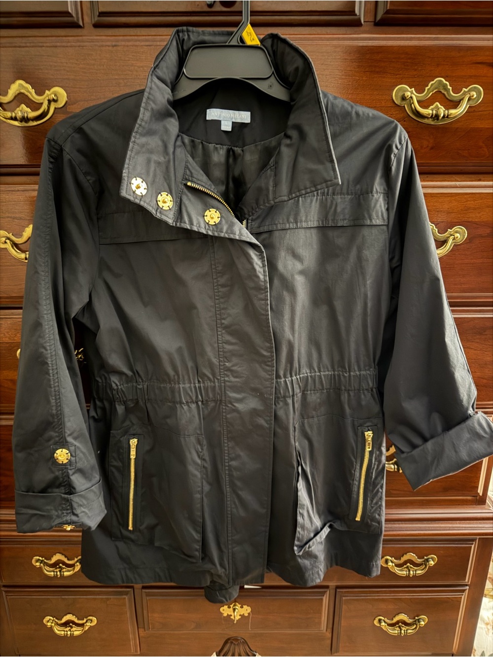 Antonio Melani Classic Women's Black Zip and gold snap front button rain jacket.